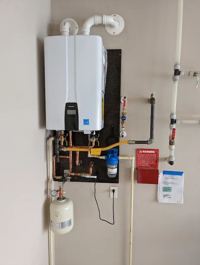 Professional plumber installing copper piping in a Tell City home